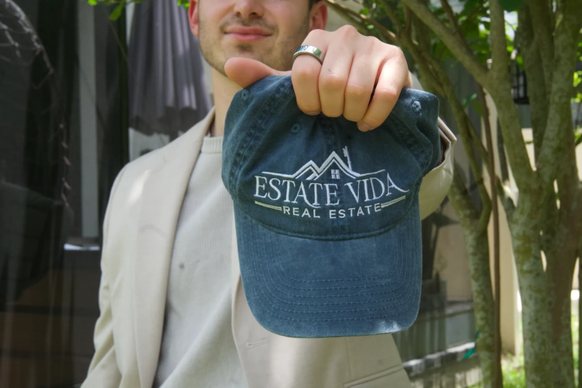 Ryan Snyder holding the Estate Vida hat